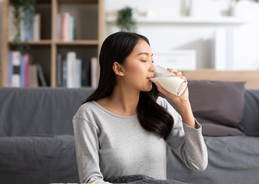 young woman drinking milk