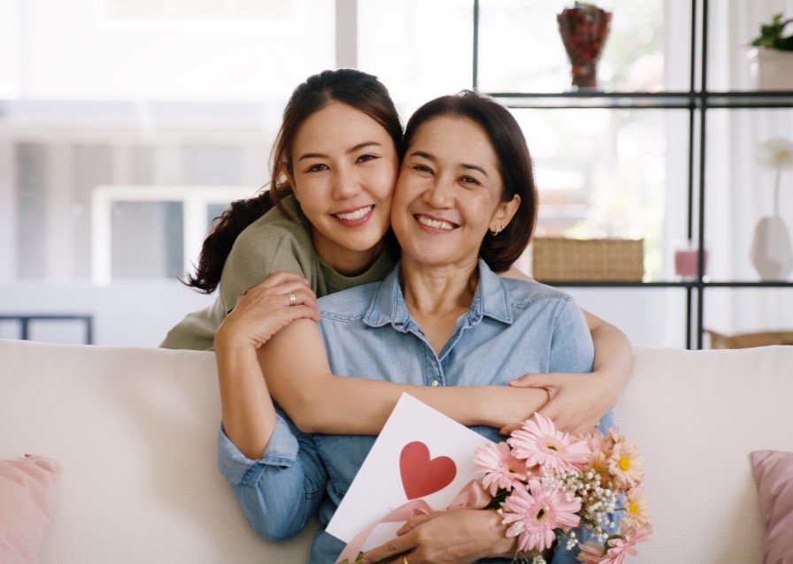happy mother and daughter hugging