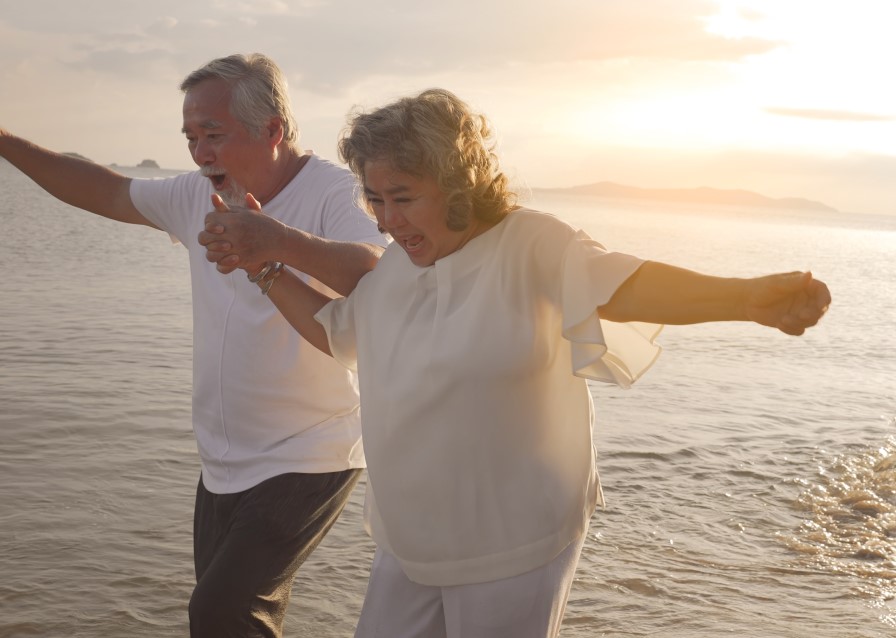elderly couple on the beach